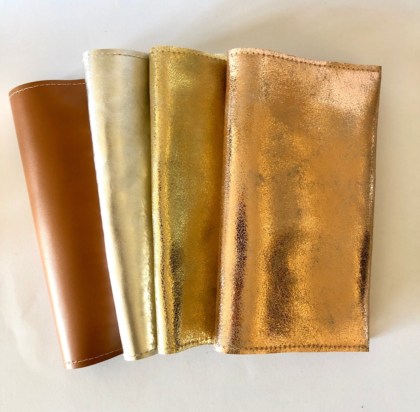 Checkbook holder in gold, silver, champagne leather