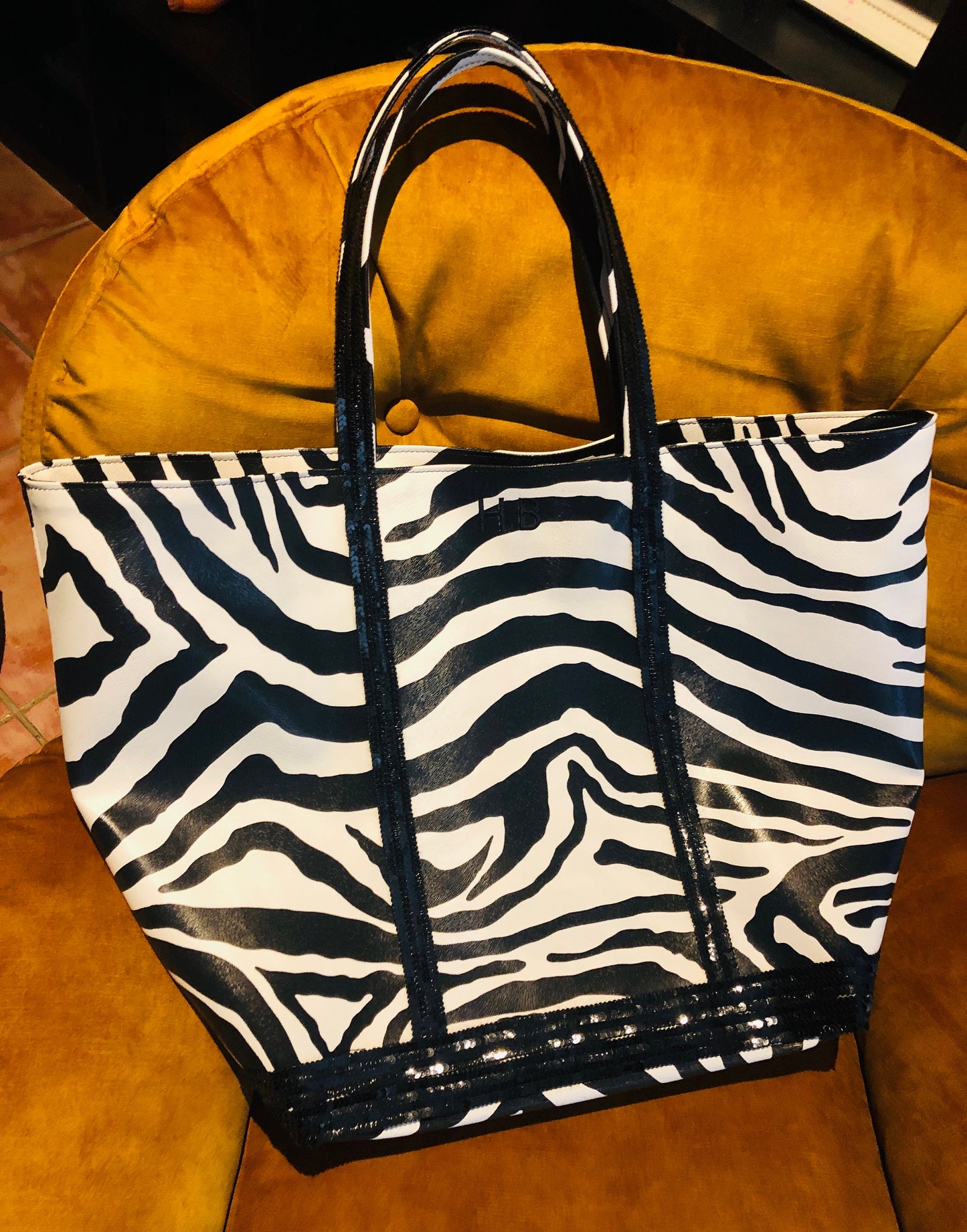 Faux leather zebra tote bag with black sequins